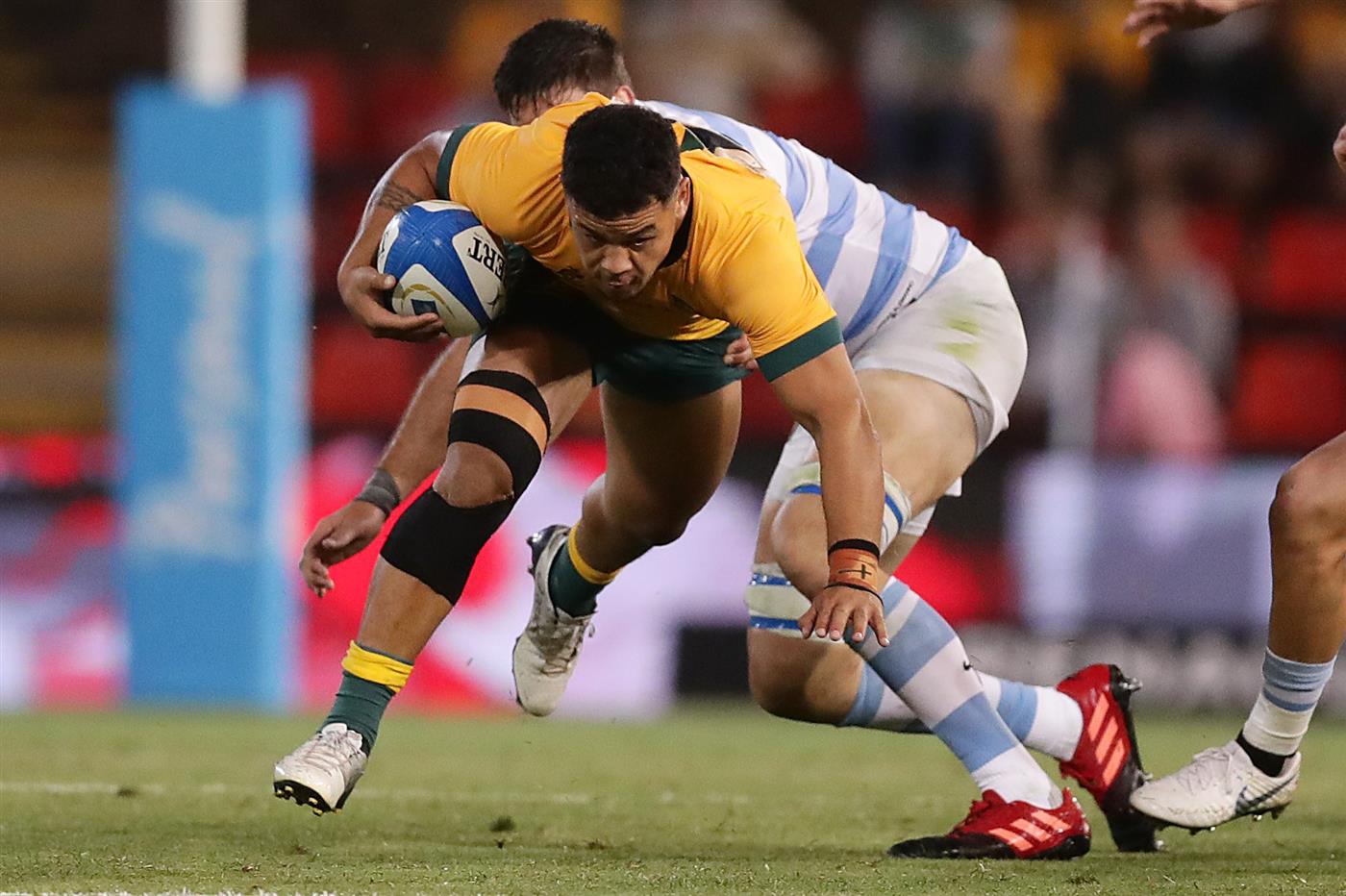 NEWCASTLE, AUSTRALIA - NOVEMBER 21: Hunter Paisami of the Wallabies is tackled during the 2020 Tri-Nations match between the Australian Wallabies and the Argentina Pumas at McDonald Jones Stadium on November 21, 2020 in Newcastle, Australia. (Photo by Mark Metcalfe/Getty Images)