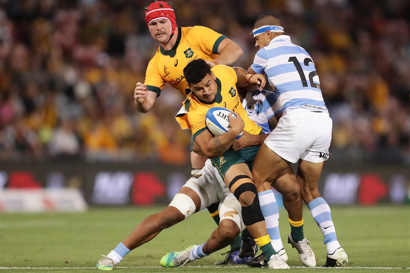 NEWCASTLE, AUSTRALIA - NOVEMBER 21: Hunter Paisami of the Wallabies is tackled by Santiago Chocobares of the Pumas during the 2020 Tri-Nations match between the Australian Wallabies and the Argentina Pumas at McDonald Jones Stadium on November 21, 2020 in Newcastle, Australia. (Photo by Mark Metcalfe/Getty Images)