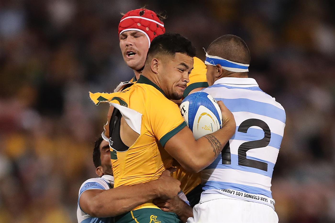 NEWCASTLE, AUSTRALIA - NOVEMBER 21: Hunter Paisami of the Wallabies is tackled by Santiago Chocobares of the Pumas during the 2020 Tri-Nations match between the Australian Wallabies and the Argentina Pumas at McDonald Jones Stadium on November 21, 2020 in Newcastle, Australia. (Photo by Mark Metcalfe/Getty Images)