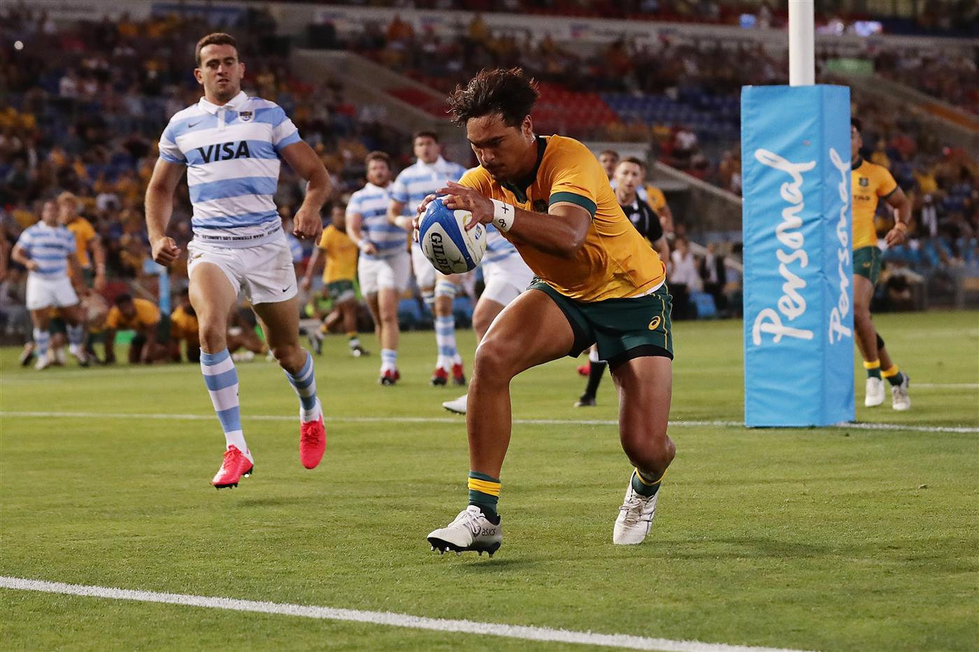 NEWCASTLE, AUSTRALIA - NOVEMBER 21: Jordan Petaia of the Wallabies touches down for a try that was later disallowed during the 2020 Tri-Nations match between the Australian Wallabies and the Argentina Pumas at McDonald Jones Stadium on November 21, 2020 in Newcastle, Australia. (Photo by Mark Metcalfe/Getty Images)