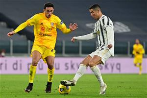 Portuguese forward Cristiano Ronaldo challenges Cagliari's Italian defender Gabriele Zappa (L) during the Italian Serie A football match Juventus vs Cagliari on November 21, 2020 at the Juventus stadium in Turin. (Photo by MIGUEL MEDINA / AFP) (Photo by MIGUEL MEDINA/AFP via Getty Images)