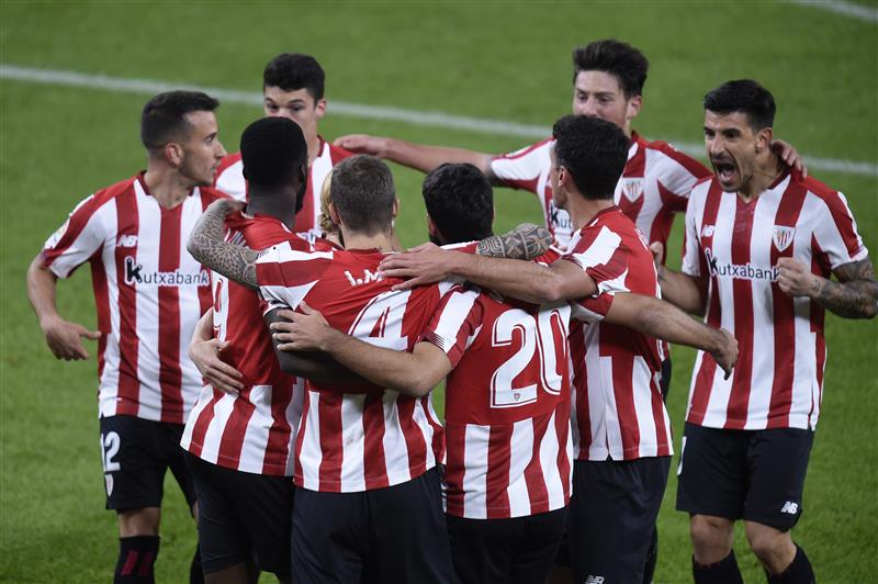 BILBAO, SPAIN - NOVEMBER 23: Inaki Williams, Inigo Martinez and Asier Villalibre of Athletic Bilbao celebrate their first goal which came through a Victor Ruiz of Real Betis (not pictured) own goal during the La Liga Santander match between Athletic Club and Real Betis at Estadio de San Mames on November 23, 2020 in Bilbao, Spain. Sporting stadiums around Spain remain under strict restrictions due to the Coronavirus Pandemic as Government social distancing laws prohibit fans inside venues resulting in games being played behind closed doors. (Photo by Juan Manuel Serrano Arce/Getty Images)