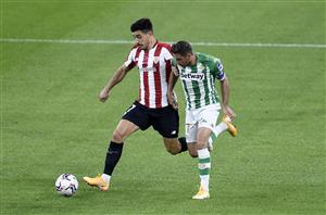 BILBAO, SPAIN - NOVEMBER 23: Yuri Berchiche of Athletic Bilbao is challenged by Joaquin of Real Betis during the La Liga Santander match between Athletic Club and Real Betis at Estadio de San Mames on November 23, 2020 in Bilbao, Spain. Sporting stadiums around Spain remain under strict restrictions due to the Coronavirus Pandemic as Government social distancing laws prohibit fans inside venues resulting in games being played behind closed doors. (Photo by Juan Manuel Serrano Arce/Getty Images)