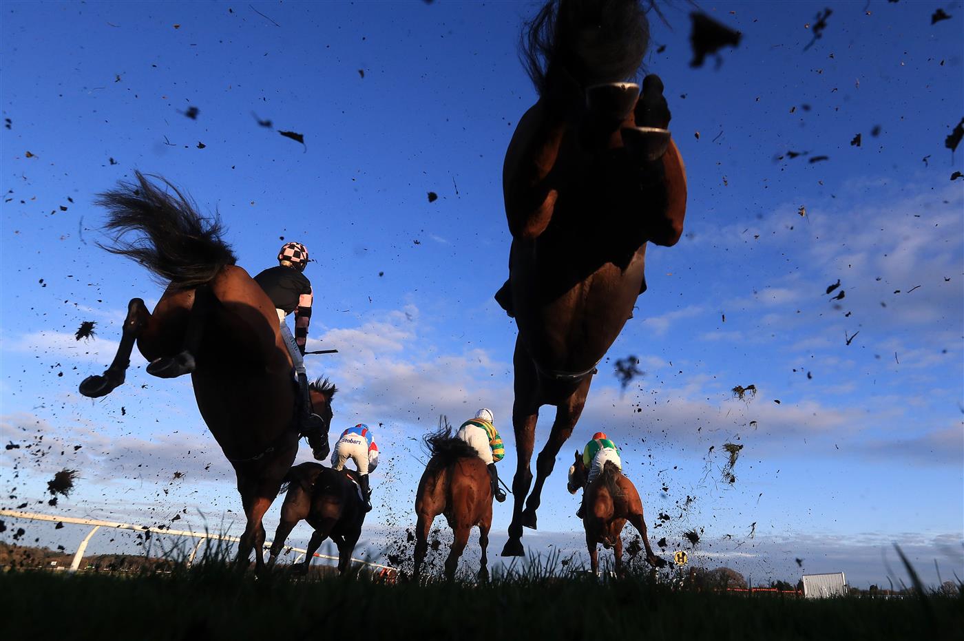 WETHERBY, UNITED KINGDOM - NOVEMBER 25: Runners and riders clear a fence during the Watch The Jumps In HD On RacingTV Handicap Chase at Wetherby Racecourse on November 25, 2020 in Wetherby, England. (Photo by Mike Egerton - Pool/Getty Images)