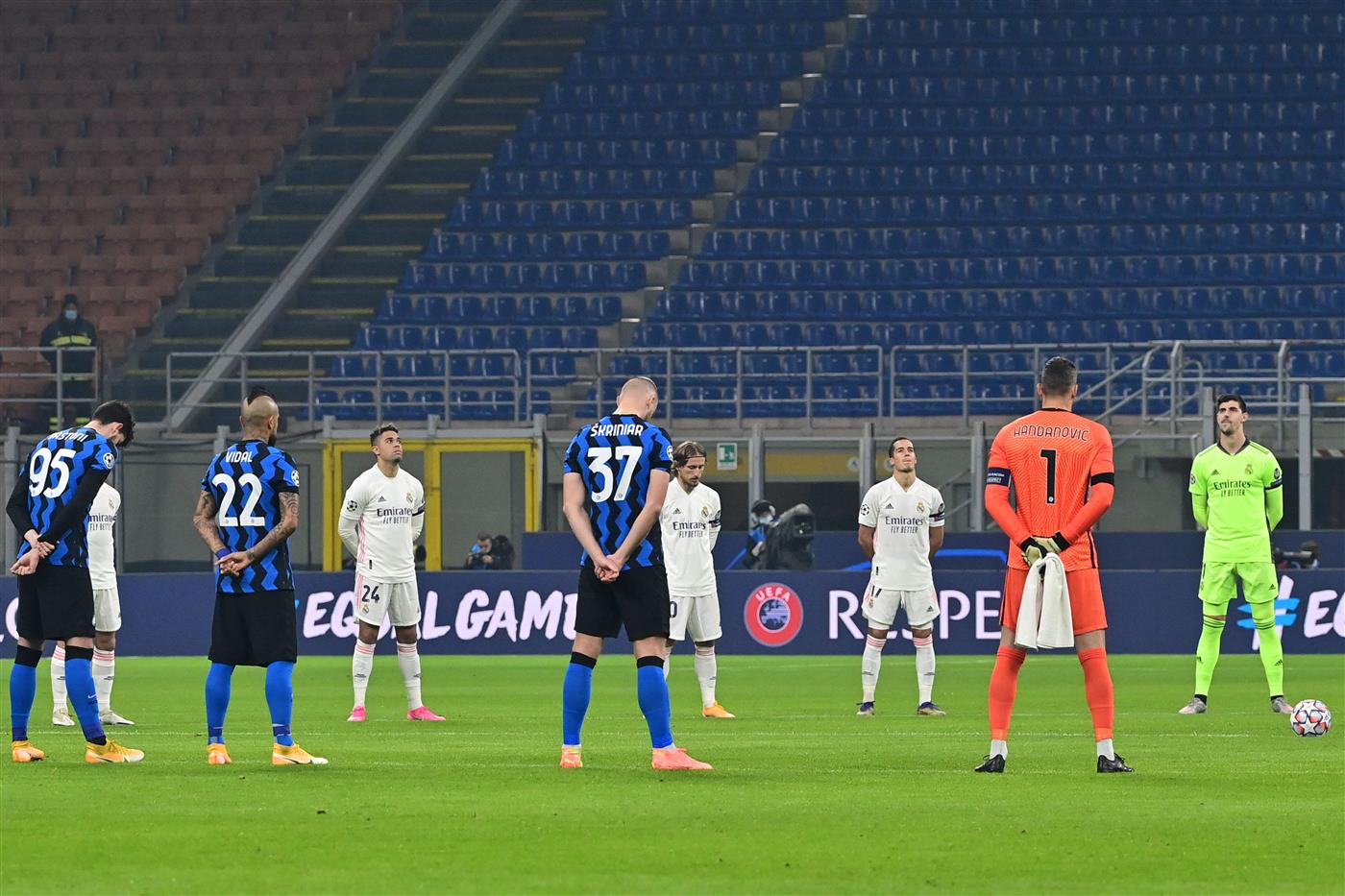 Players hold a minute of silence to pay tribute to Argentine football legend Diego Maradona following the announcement of his death earlier in the day, prior to the UEFA Champions League Group B football match Inter Milan vs Real Madrid on November 25, 2020 at the Giuseppe-Meazza (San Siro) stadium in Milan. - Argentine football legend Diego Maradona has died at the age of 60, his spokesman announced November 25, 2020. (Photo by MIGUEL MEDINA / AFP) (Photo by MIGUEL MEDINA/AFP via Getty Images)