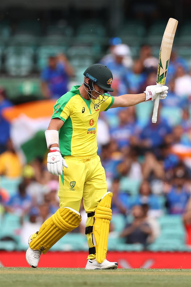 SYDNEY, AUSTRALIA - NOVEMBER 29: David Warner of Australia celebrates reaching 50 runs during game two of the One Day International series between Australia and India at Sydney Cricket Ground on November 29, 2020 in Sydney, Australia. (Photo by Cameron Spencer/Getty Images)