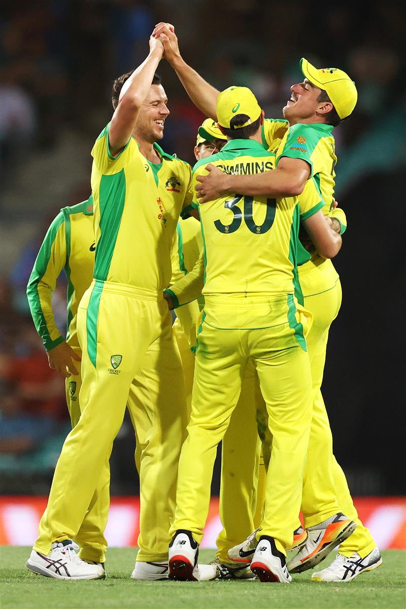 SYDNEY, AUSTRALIA - NOVEMBER 29: Josh Hazlewood of Australia celebrates with Moises Henriques of Australia after dismissing Virat Kohli of India during game two of the One Day International series between Australia and India at Sydney Cricket Ground on November 29, 2020 in Sydney, Australia. (Photo by Cameron Spencer/Getty Images)