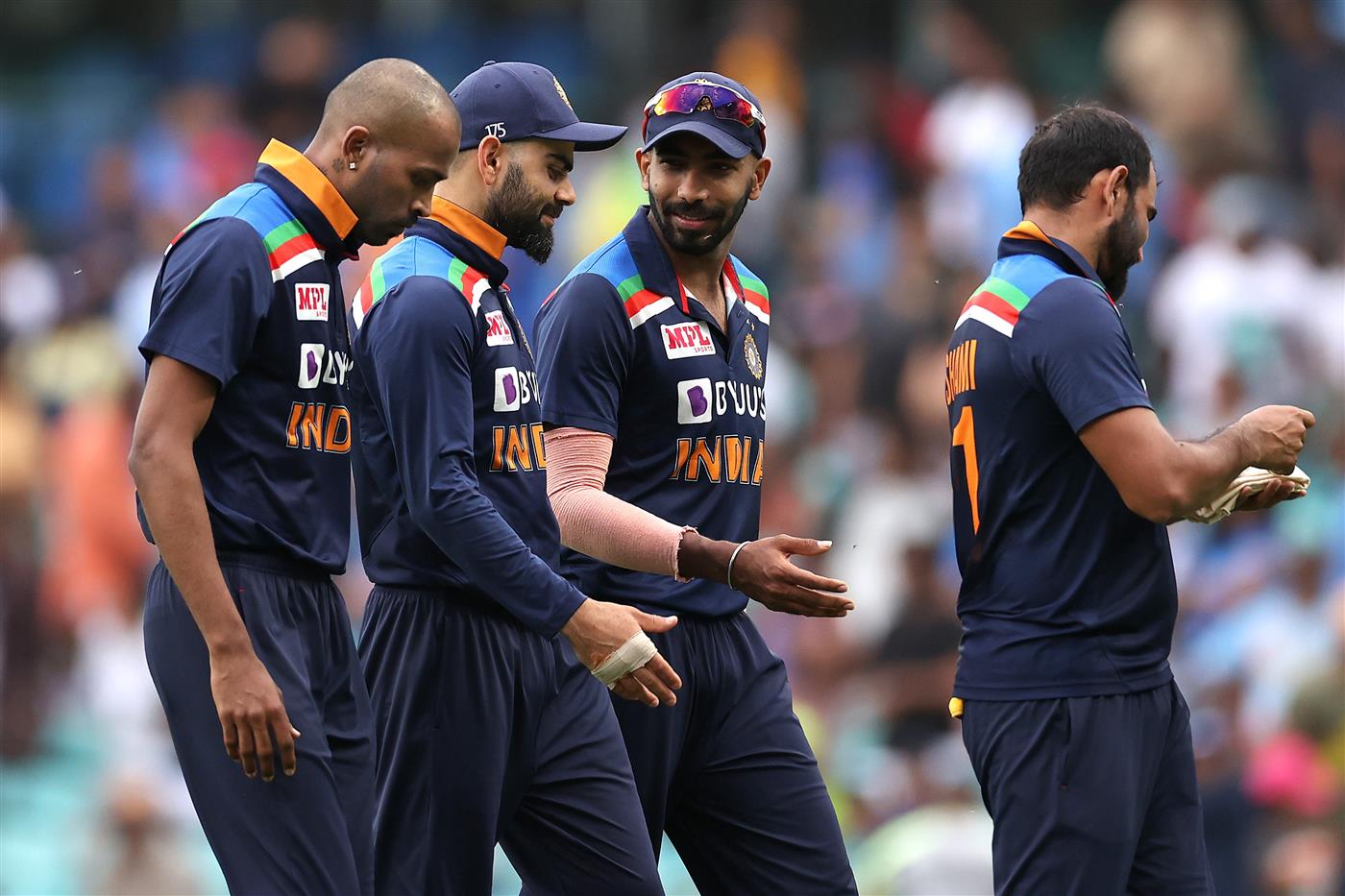 SYDNEY, AUSTRALIA - NOVEMBER 29: Virat Kohli and his Indian team mates walk off the field during game two of the One Day International series between Australia and India at Sydney Cricket Ground on November 29, 2020 in Sydney, Australia. (Photo by Cameron Spencer/Getty Images)