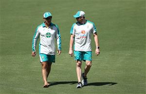 CANBERRA, AUSTRALIA - DECEMBER 01: Justin Langer, coach of Australia,  speaks to Steve Smith of Australia during an Australian ODI nets session at Manuka Oval on December 01, 2020 in Canberra, Australia. (Photo by Ryan Pierse/Getty Images)