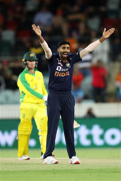 CANBERRA, AUSTRALIA - DECEMBER 02: Jasprit Bumrah of India successfully appeasls for the wicket of Adam Zampa of Australia to claim victory for India during game three of the One Day International series between Australia and India at Manuka Oval on December 02, 2020 in Canberra, Australia. (Photo by Mark Kolbe/Getty Images)