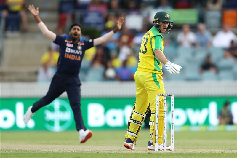 CANBERRA, AUSTRALIA - DECEMBER 02: Jasprit Bumrah of India  shows his frustration as Marnus Labuschagne of Australia bats during game three of the One Day International series between Australia and India at Manuka Oval on December 02, 2020 in Canberra, Australia. (Photo by Mark Kolbe/Getty Images)