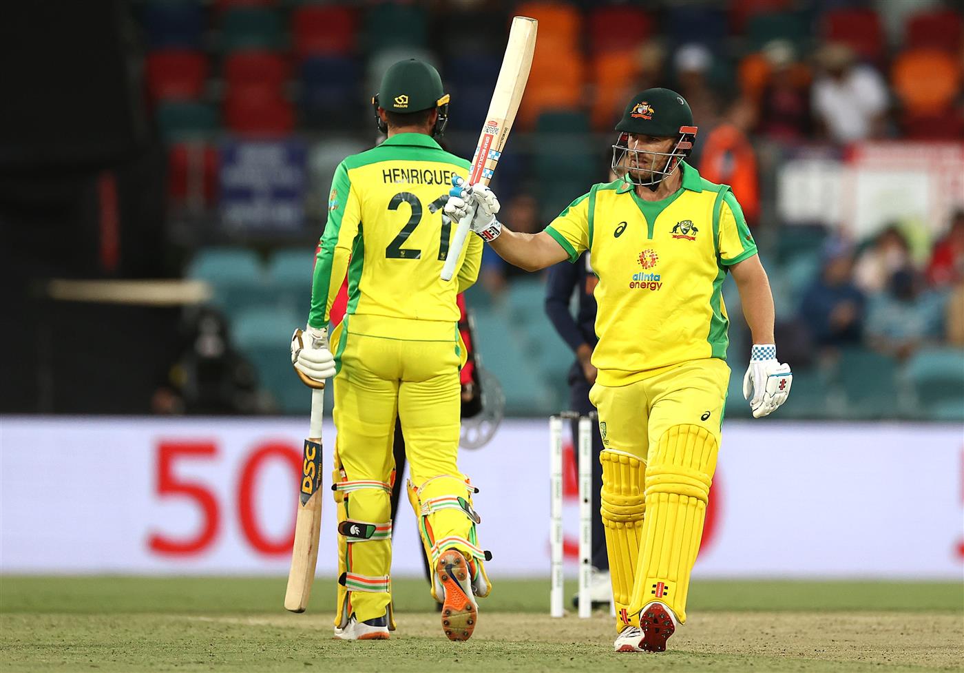 CANBERRA, AUSTRALIA - DECEMBER 02: Aaron Finch of Australia celebrates after reaching his half century during game three of the One Day International series between Australia and India at Manuka Oval on December 02, 2020 in Canberra, Australia. (Photo by Ryan Pierse/Getty Images)