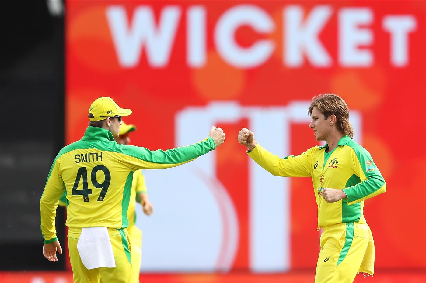 CANBERRA, AUSTRALIA - DECEMBER 02: Adam Zampa of Australia celebrates with Steve Smith after taking the wicket of Shreyas Iyer of India during game three of the One Day International series between Australia and India at Manuka Oval on December 02, 2020 in Canberra, Australia. (Photo by Mark Kolbe/Getty Images)