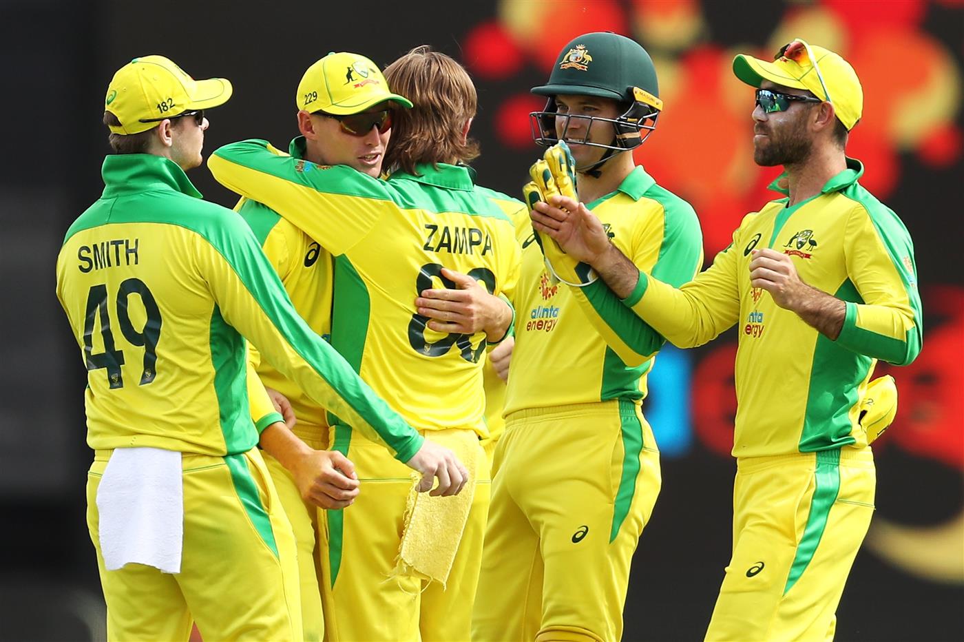 CANBERRA, AUSTRALIA - DECEMBER 02: Marnus Labuschagne and Adam Zampa of Australia celebrate with their team mates after combining to take the wicket of Shreyas Iyer of India during game three of the One Day International series between Australia and India at Manuka Oval on December 02, 2020 in Canberra, Australia. (Photo by Mark Kolbe/Getty Images)