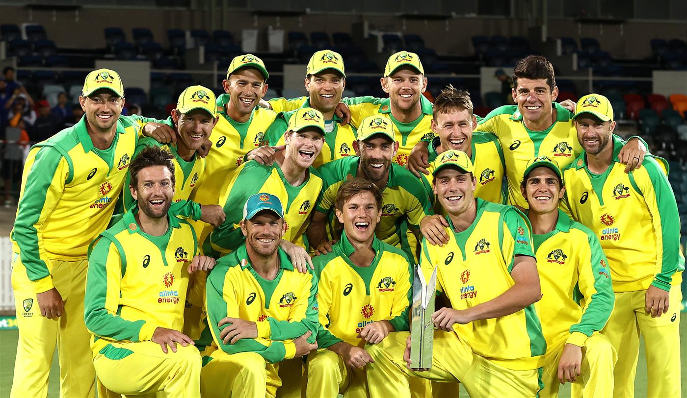 CANBERRA, AUSTRALIA - DECEMBER 02: Australia celebrate with the Series Trophy after game three of the One Day International series between Australia and India at Manuka Oval on December 02, 2020 in Canberra, Australia. (Photo by Ryan Pierse/Getty Images)