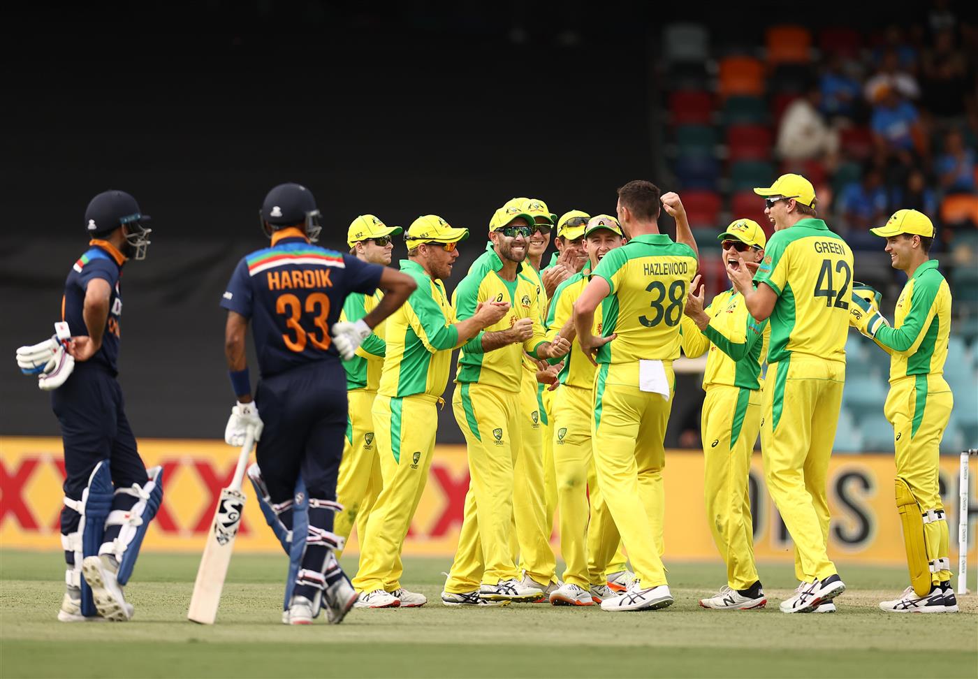 CANBERRA, AUSTRALIA - DECEMBER 02: Josh Hazlewood of Australia celebrates after taking the wicket of Virat Kohli of India during game three of the One Day International series between Australia and India at Manuka Oval on December 02, 2020 in Canberra, Australia. (Photo by Ryan Pierse/Getty Images)