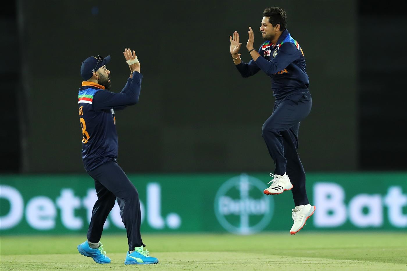 CANBERRA, AUSTRALIA - DECEMBER 02: Virat Kohli and Kuldeep Yadav of India celebrates Yadav taking the wicket of Cameron Green of Australia during game three of the One Day International series between Australia and India at Manuka Oval on December 02, 2020 in Canberra, Australia. (Photo by Mark Kolbe/Getty Images)