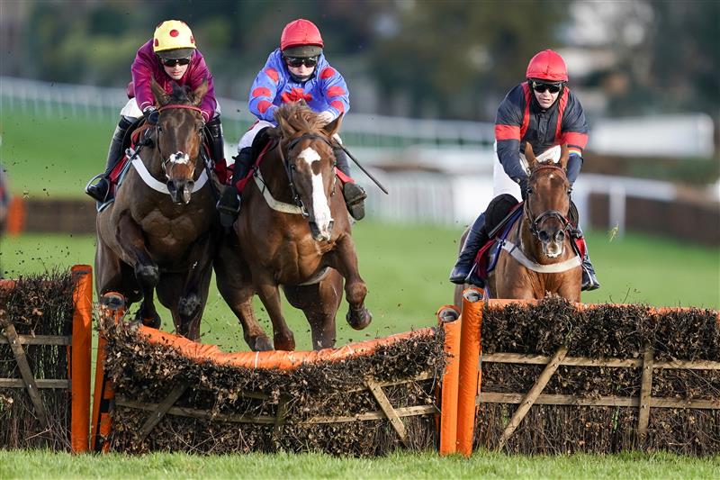 ESHER, ENGLAND - DECEMBER 05: Jamie Moore riding Golden Boy Grey (C, red cap) clear the last to win The  at Sandown Park on December 05, 2020 in Esher, England. Owners and a limited number of the public are allowed to attend the meeting due to the Coronavirus pandemic. (Photo by Alan Crowhurst/Getty Images)My Oddsboost On Betfair 'National Hunt' Novices' Hurdle