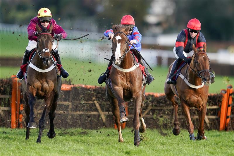 ESHER, ENGLAND - DECEMBER 05: Jamie Moore riding Golden Boy Grey (C, red cap) clear the last to win The  at Sandown Park on December 05, 2020 in Esher, England. Owners and a limited number of the public are allowed to attend the meeting due to the Coronavirus pandemic. (Photo by Alan Crowhurst/Getty Images)My Oddsboost On Betfair 'National Hunt' Novices' Hurdle