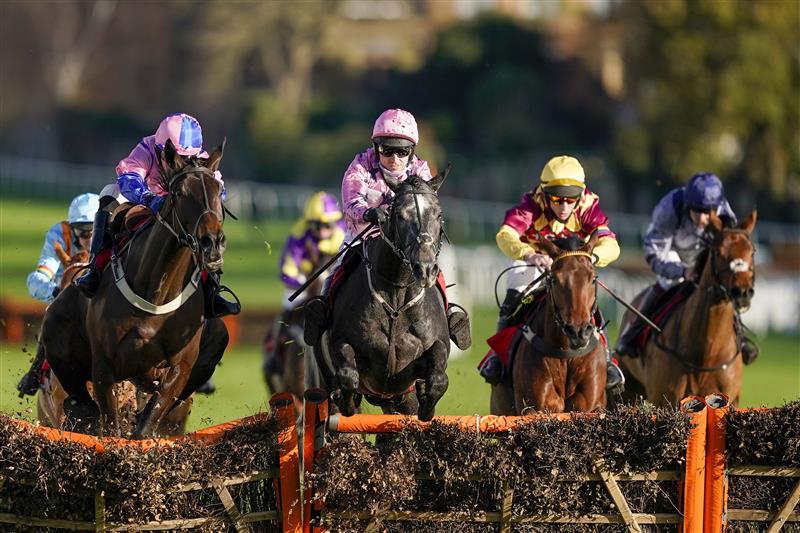 ESHER, ENGLAND - DECEMBER 05: Paddy Brennan riding Elham Valley (pink, pink cap) clear the last to win The Betfair Free Bet On The 1.50 Introductory Juvenile Hurdle at Sandown Park on December 05, 2020 in Esher, England. Owners and a limited number of the public are allowed to attend the meeting due to the Coronavirus pandemic. (Photo by Alan Crowhurst/Getty Images)