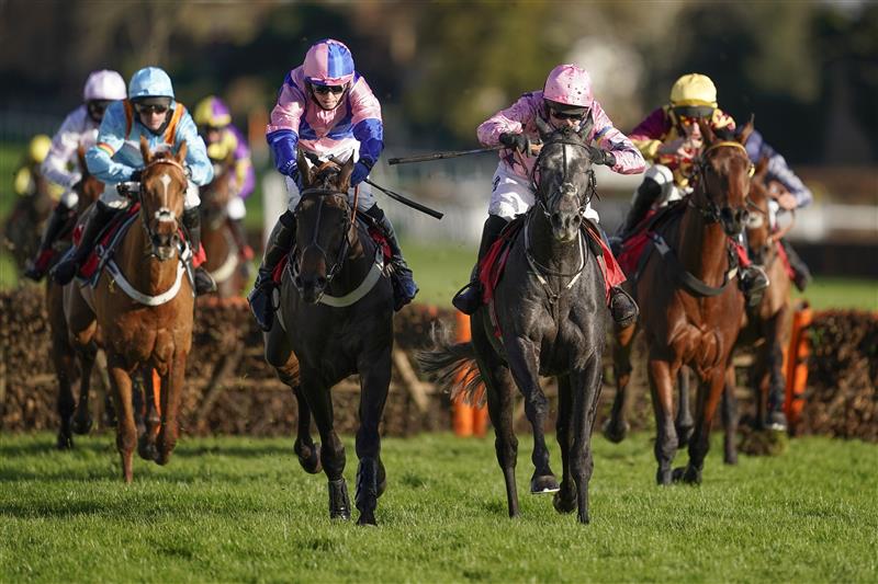 ESHER, ENGLAND - DECEMBER 05: Paddy Brennan riding Elham Valley (pink, pink cap) clear the last to win The Betfair Free Bet On The 1.50 Introductory Juvenile Hurdle at Sandown Park on December 05, 2020 in Esher, England. Owners and a limited number of the public are allowed to attend the meeting due to the Coronavirus pandemic. (Photo by Alan Crowhurst/Getty Images)