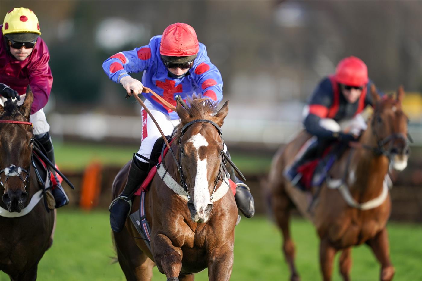 ESHER, ENGLAND - DECEMBER 05: Jamie Moore riding Golden Boy Grey (C, red cap) clear the last to win The  at Sandown Park on December 05, 2020 in Esher, England. Owners and a limited number of the public are allowed to attend the meeting due to the Coronavirus pandemic. (Photo by Alan Crowhurst/Getty Images)My Oddsboost On Betfair 'National Hunt' Novices' Hurdle