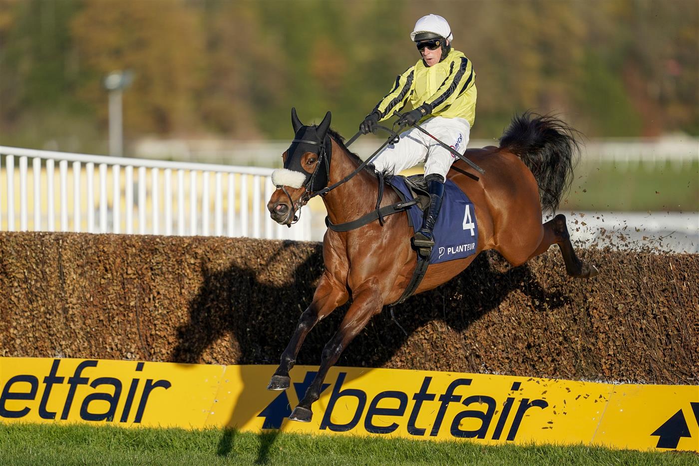 ESHER, ENGLAND - DECEMBER 05: Harry Skelton riding Allmankind clear the last to win The Planteur At Chapel Stud Henry VIII Novices' Chase at Sandown Park on December 05, 2020 in Esher, England. Owners and a limited number of the public are allowed to attend the meeting due to the Coronavirus pandemic. (Photo by Alan Crowhurst/Getty Images)