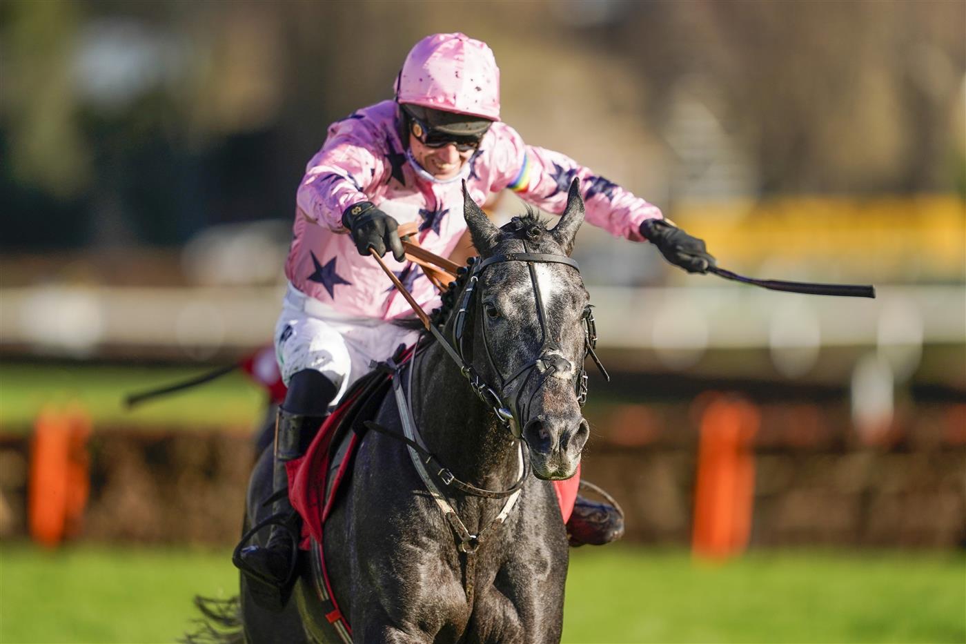 ESHER, ENGLAND - DECEMBER 05: Paddy Brennan riding Elham Valley (pink, pink cap) clear the last to win The Betfair Free Bet On The 1.50 Introductory Juvenile Hurdle at Sandown Park on December 05, 2020 in Esher, England. Owners and a limited number of the public are allowed to attend the meeting due to the Coronavirus pandemic. (Photo by Alan Crowhurst/Getty Images)