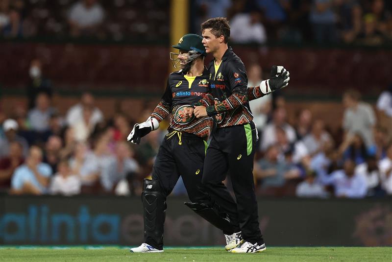 SYDNEY, AUSTRALIA - DECEMBER 06: Mitch Swepson of Australia is congratulated by Matthew Wade after getting the wicket of Sanju Samson of India during game two of the Twenty20 International series between Australia and India at Sydney Cricket Ground on December 06, 2020 in Sydney, Australia. (Photo by Ryan Pierse/Getty Images)