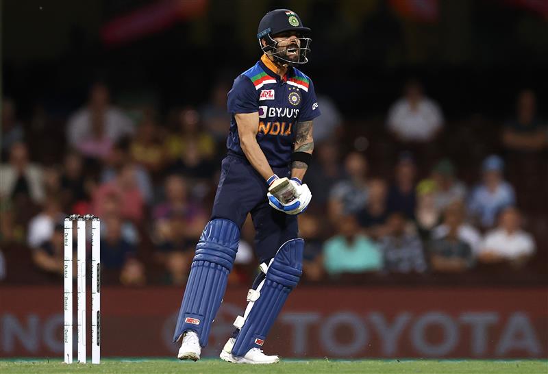 SYDNEY, AUSTRALIA - DECEMBER 06: Virat Kohli of India reacts after missing a shot during game two of the Twenty20 International series between Australia and India at Sydney Cricket Ground on December 06, 2020 in Sydney, Australia. (Photo by Ryan Pierse/Getty Images)