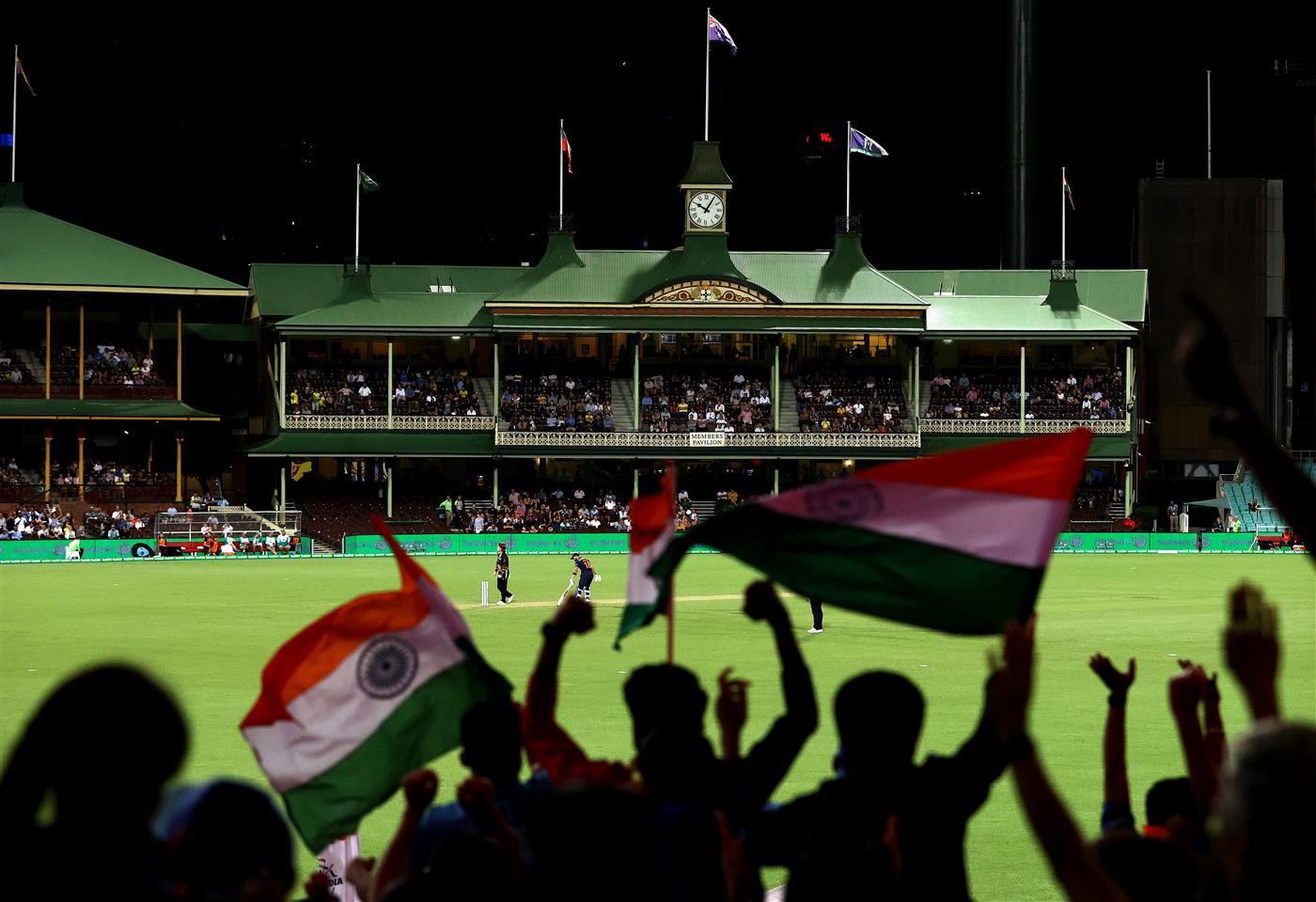 SYDNEY, AUSTRALIA - DECEMBER 06: Indian fans show their support during game two of the Twenty20 International series between Australia and India at Sydney Cricket Ground on December 06, 2020 in Sydney, Australia. (Photo by Ryan Pierse/Getty Images)