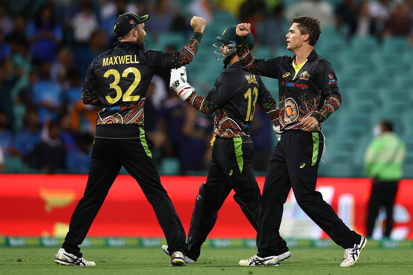 SYDNEY, AUSTRALIA - DECEMBER 06: Mitch Swepson of Australia is congratulated by team mates after getting the wicket of Sanju Samson of India during game two of the Twenty20 International series between Australia and India at Sydney Cricket Ground on December 06, 2020 in Sydney, Australia. (Photo by Ryan Pierse/Getty Images)