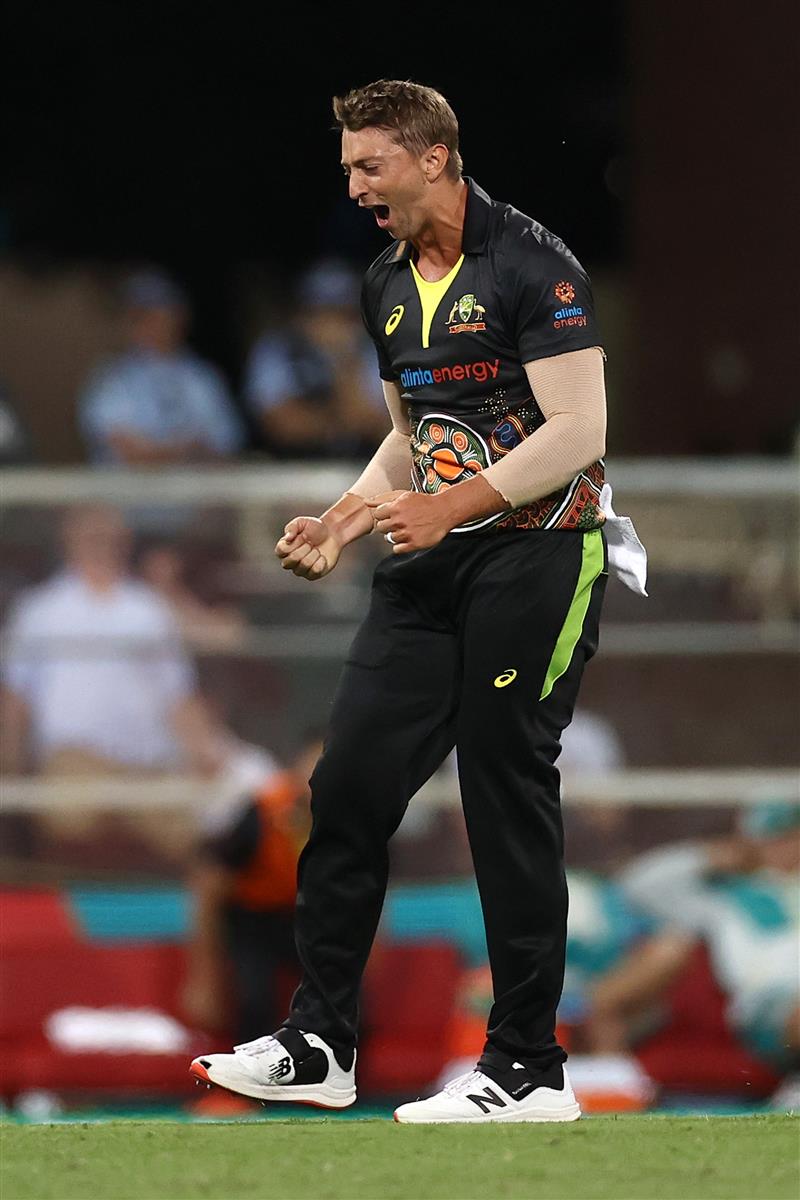 SYDNEY, AUSTRALIA - DECEMBER 06: Daniel Sams of Australia celebrates getting the wicket of Virat Kohli of India during game two of the Twenty20 International series between Australia and India at Sydney Cricket Ground on December 06, 2020 in Sydney, Australia. (Photo by Ryan Pierse/Getty Images)