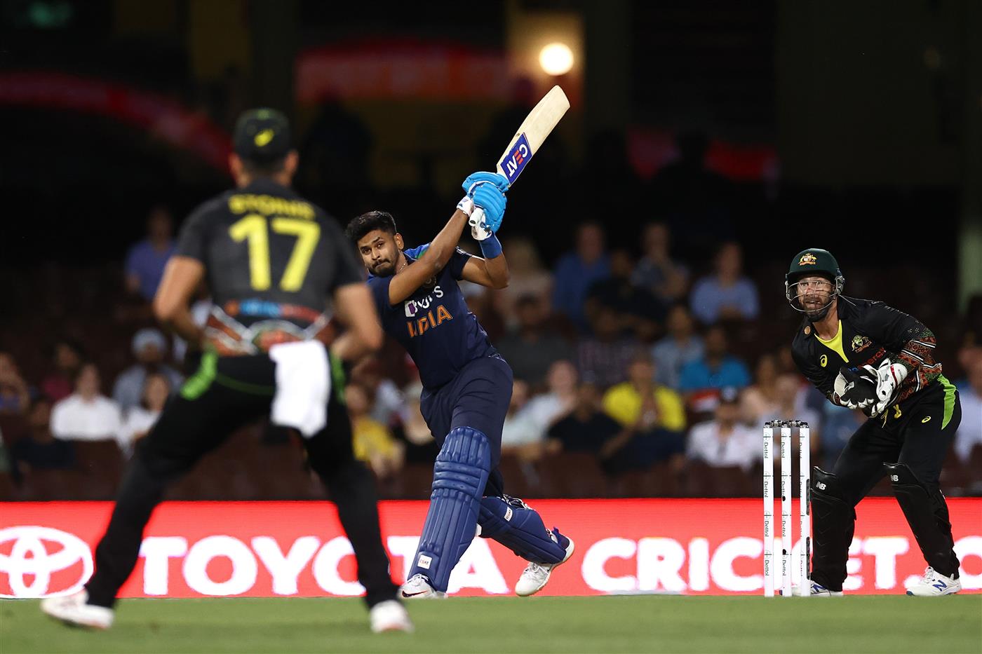 SYDNEY, AUSTRALIA - DECEMBER 06: Shreyas Iyer of India hits a six during game two of the Twenty20 International series between Australia and India at Sydney Cricket Ground on December 06, 2020 in Sydney, Australia. (Photo by Ryan Pierse/Getty Images)