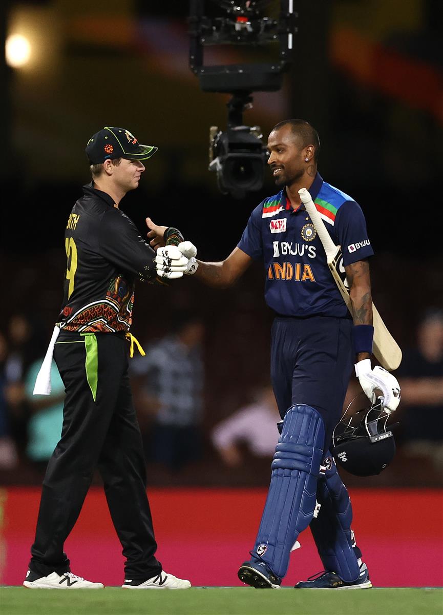 SYDNEY, AUSTRALIA - DECEMBER 06: Hardik Pandya of India is congratulated by Steve Smith of Australia during game two of the Twenty20 International series between Australia and India at Sydney Cricket Ground on December 06, 2020 in Sydney, Australia. (Photo by Ryan Pierse/Getty Images)