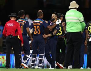 SYDNEY, AUSTRALIA - DECEMBER 06: Hardik Pandya and 
Shreyas Iyer of India are congratulated by Virat Kohli of India after winning game two of the Twenty20 International series between Australia and India at Sydney Cricket Ground on December 06, 2020 in Sydney, Australia. (Photo by Ryan Pierse/Getty Images)