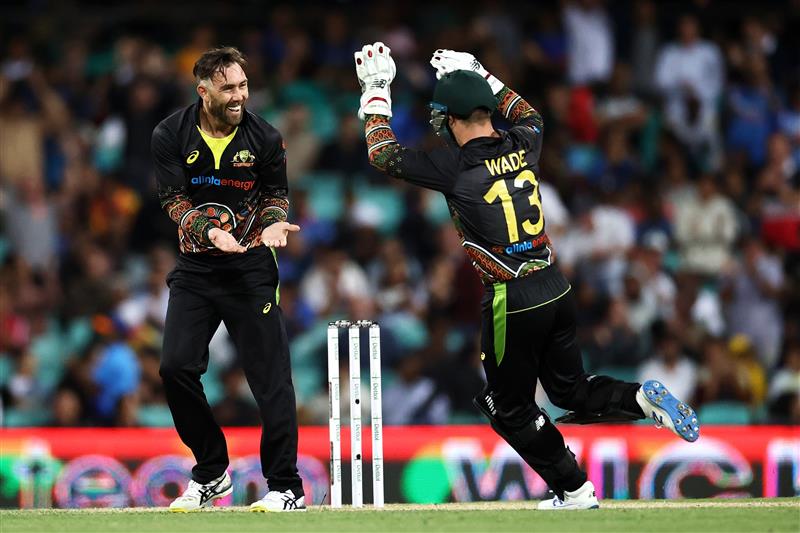SYDNEY, AUSTRALIA - DECEMBER 08: Glenn Maxwell of Australia celebrates with Matthew Wade of Australia after dismissing KL Rahul of India during game three of the Twenty20 International series between Australia and India at Sydney Cricket Ground on December 08, 2020 in Sydney, Australia. (Photo by Cameron Spencer/Getty Images)