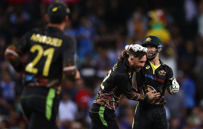 SYDNEY, AUSTRALIA - DECEMBER 08: Glenn Maxwell of Australia celebrates after taking the wicket of KL Rahul of India during game three of the Twenty20 International series between Australia and India at Sydney Cricket Ground on December 08, 2020 in Sydney, Australia. (Photo by Ryan Pierse/Getty Images)