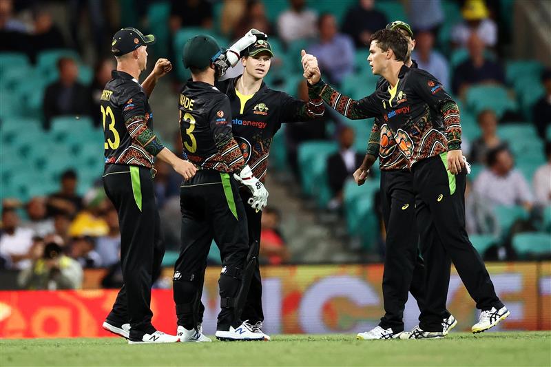 SYDNEY, AUSTRALIA - DECEMBER 08: Steve Smith of Australia celebrates catching Sanju Samson of India off a delivery by Mitchell Swepson of Australia during game three of the Twenty20 International series between Australia and India at Sydney Cricket Ground on December 08, 2020 in Sydney, Australia. (Photo by Cameron Spencer/Getty Images)