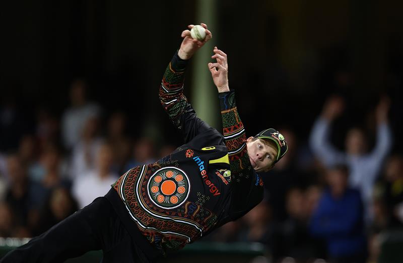 SYDNEY, AUSTRALIA - DECEMBER 08:  Steve Smith of Australia dives to stop a boundary during game three of the Twenty20 International series between Australia and India at Sydney Cricket Ground on December 08, 2020 in Sydney, Australia. (Photo by Ryan Pierse/Getty Images)