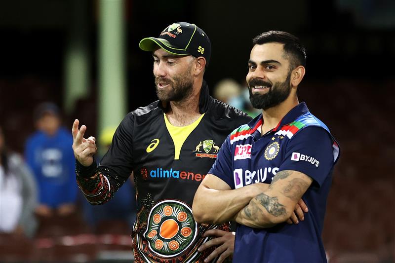 SYDNEY, AUSTRALIA - DECEMBER 08: Glenn Maxwell of Australia talks to Virat Kohli of India following game three of the Twenty20 International series between Australia and India at Sydney Cricket Ground on December 08, 2020 in Sydney, Australia. (Photo by Cameron Spencer/Getty Images)