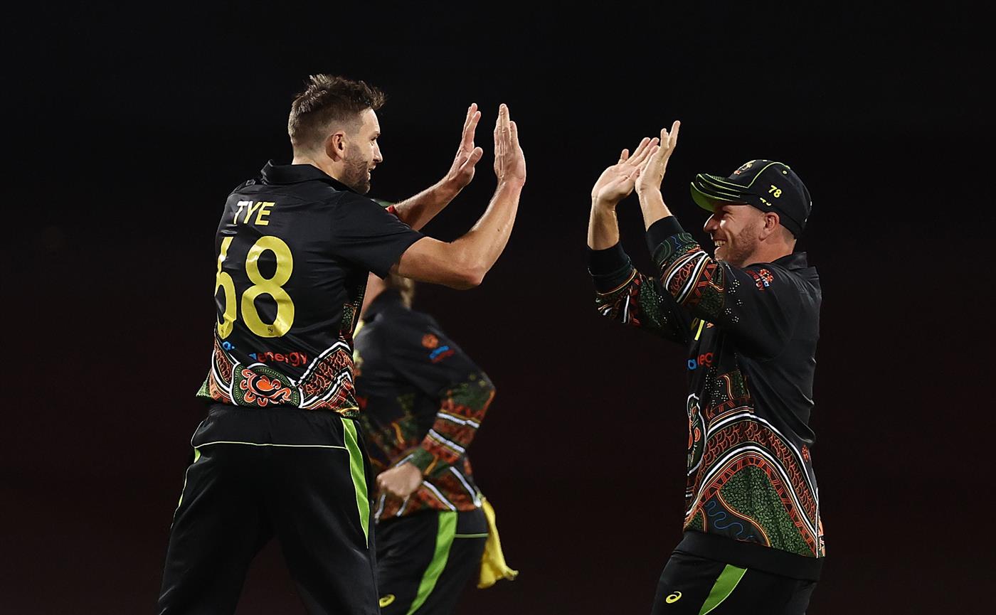 SYDNEY, AUSTRALIA - DECEMBER 08: Andrew Tye of Australia celebrates after taking the wicket of Virat Kohli of India during game three of the Twenty20 International series between Australia and India at Sydney Cricket Ground on December 08, 2020 in Sydney, Australia. (Photo by Ryan Pierse/Getty Images)