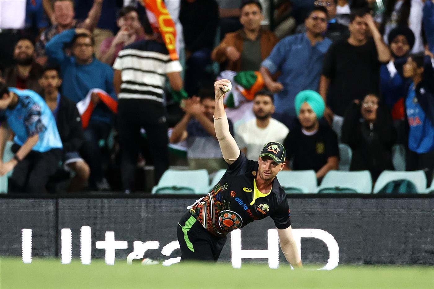 SYDNEY, AUSTRALIA - DECEMBER 08: Daniel Sams of Australia catches Shikhar Dhawan of India off a delivery by Mitchell Swepson of Australia during game three of the Twenty20 International series between Australia and India at Sydney Cricket Ground on December 08, 2020 in Sydney, Australia. (Photo by Cameron Spencer/Getty Images)