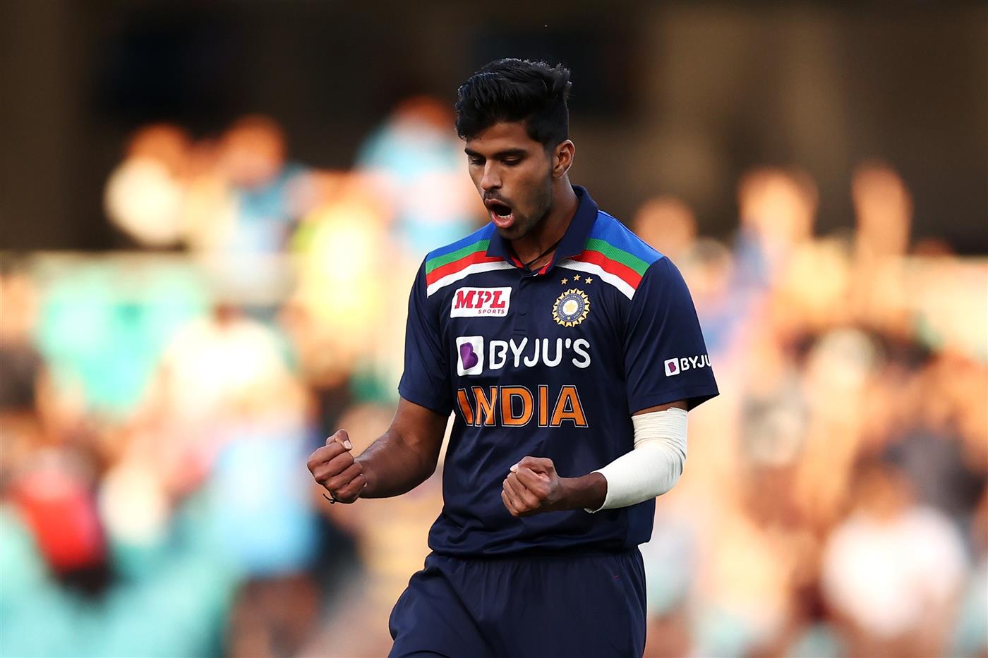 SYDNEY, AUSTRALIA - DECEMBER 08: Washington Sundar of India 
celebrates dismissing Aaron Finch of Australia during game three of the Twenty20 International series between Australia and India at Sydney Cricket Ground on December 08, 2020 in Sydney, Australia. (Photo by Cameron Spencer/Getty Images)