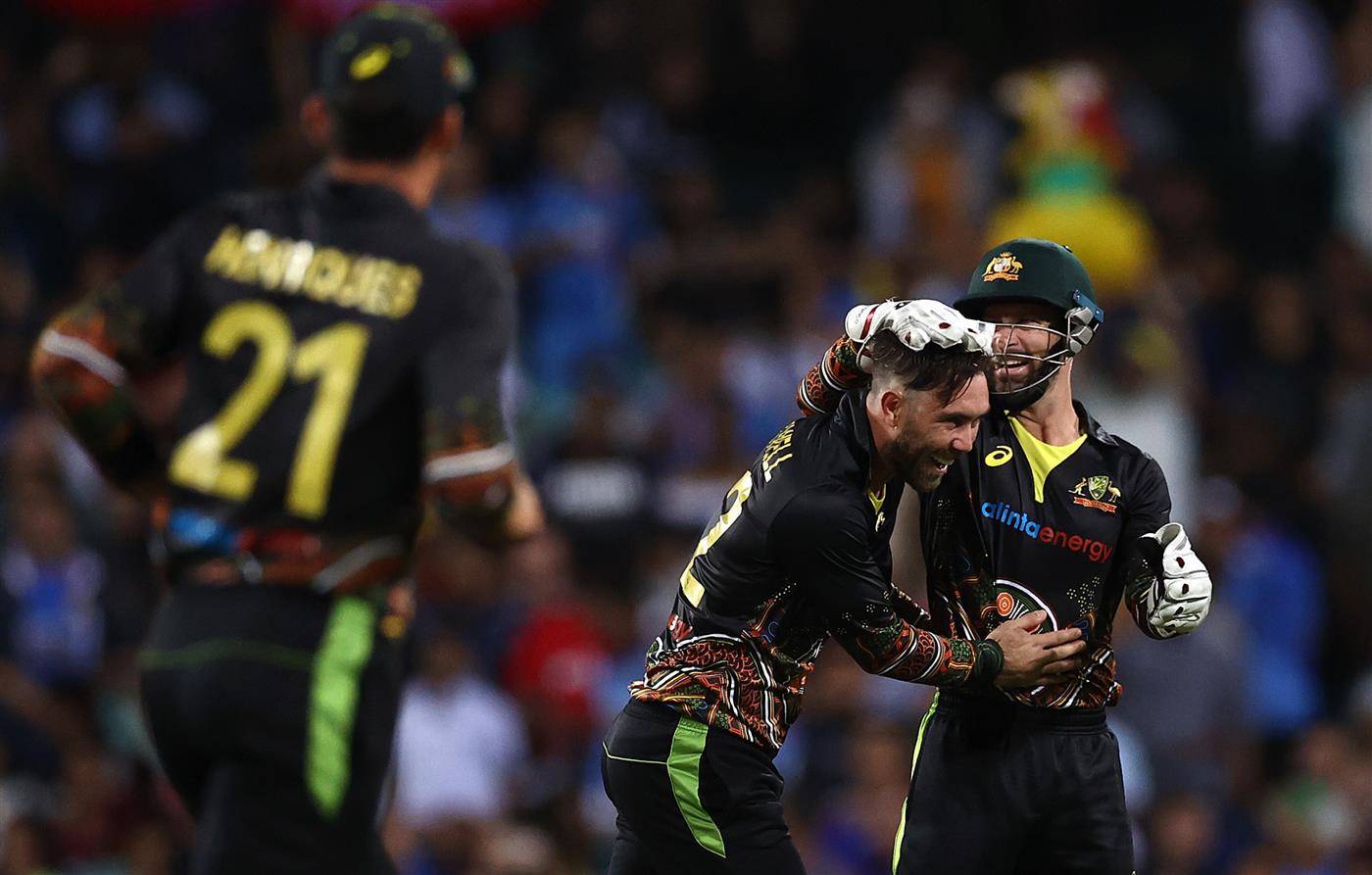 SYDNEY, AUSTRALIA - DECEMBER 08: Glenn Maxwell of Australia celebrates after taking the wicket of KL Rahul of India during game three of the Twenty20 International series between Australia and India at Sydney Cricket Ground on December 08, 2020 in Sydney, Australia. (Photo by Ryan Pierse/Getty Images)