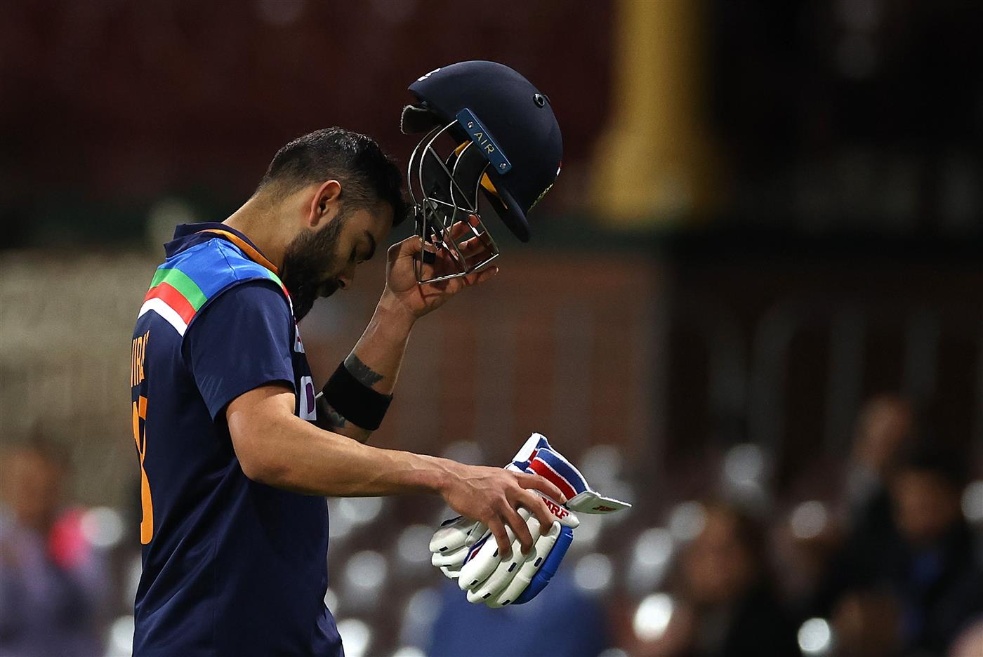 SYDNEY, AUSTRALIA - DECEMBER 08: Virat Kohli of India looks dejected after being dismissed by Andrew Tye of Australia during game three of the Twenty20 International series between Australia and India at Sydney Cricket Ground on December 08, 2020 in Sydney, Australia. (Photo by Ryan Pierse/Getty Images)