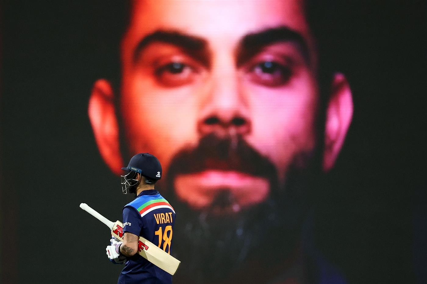SYDNEY, AUSTRALIA - DECEMBER 08: Virat Kohli of India leaves the field after being dismissed by Andrew Tye of Australia during game three of the Twenty20 International series between Australia and India at Sydney Cricket Ground on December 08, 2020 in Sydney, Australia. (Photo by Cameron Spencer/Getty Images)