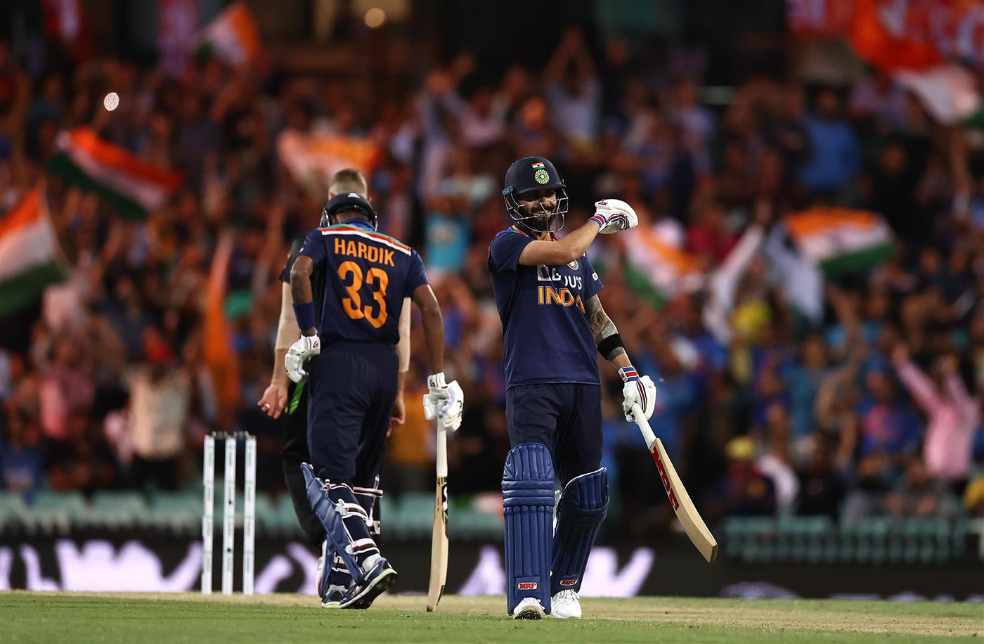 SYDNEY, AUSTRALIA - DECEMBER 08: Virat Kohli of India reacts while batting during game three of the Twenty20 International series between Australia and India at Sydney Cricket Ground on December 08, 2020 in Sydney, Australia. (Photo by Ryan Pierse/Getty Images)