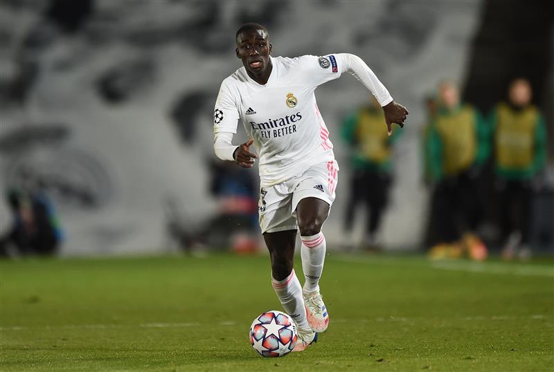 MADRID, SPAIN - DECEMBER 09:   Ferland Mendy of Real Madrid runs with the ball during the UEFA Champions League Group B stage match between Real Madrid and Borussia Moenchengladbach at Estadio Alfredo di Stefano on December 09, 2020 in Madrid, Spain. Sporting stadiums around Spain remain under strict restrictions due to the Coronavirus Pandemic as Government social distancing laws prohibit fans inside venues resulting in games being played behind closed doors. (Photo by Denis Doyle/Getty Images)