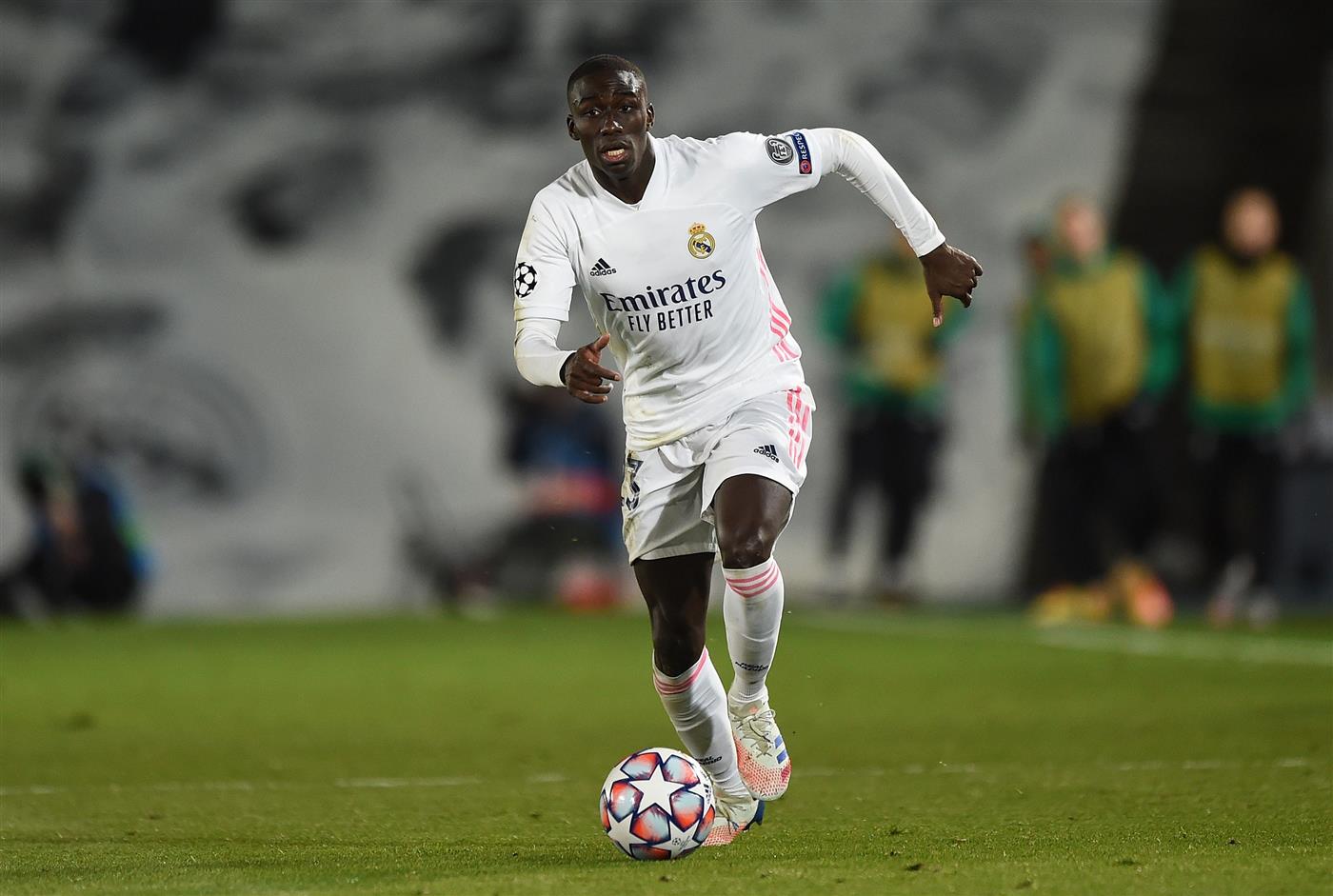 MADRID, SPAIN - DECEMBER 09:   Ferland Mendy of Real Madrid runs with the ball during the UEFA Champions League Group B stage match between Real Madrid and Borussia Moenchengladbach at Estadio Alfredo di Stefano on December 09, 2020 in Madrid, Spain. Sporting stadiums around Spain remain under strict restrictions due to the Coronavirus Pandemic as Government social distancing laws prohibit fans inside venues resulting in games being played behind closed doors. (Photo by Denis Doyle/Getty Images)